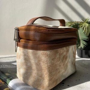 Cowhide cosmetic bag in brown and white for any special woman